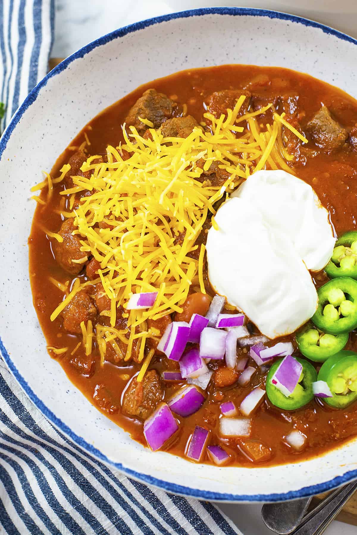 Overhead view of steak chili in bowl.
