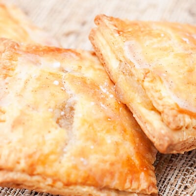 A close up of two homemade apple poptarts