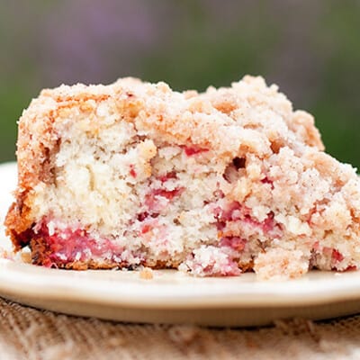 A close up of raspberry coffee cake on a plate