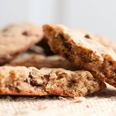 A stack of cookies on a woven placemat.