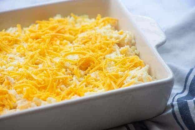 cheesy hashbrown casserole with cheese on top