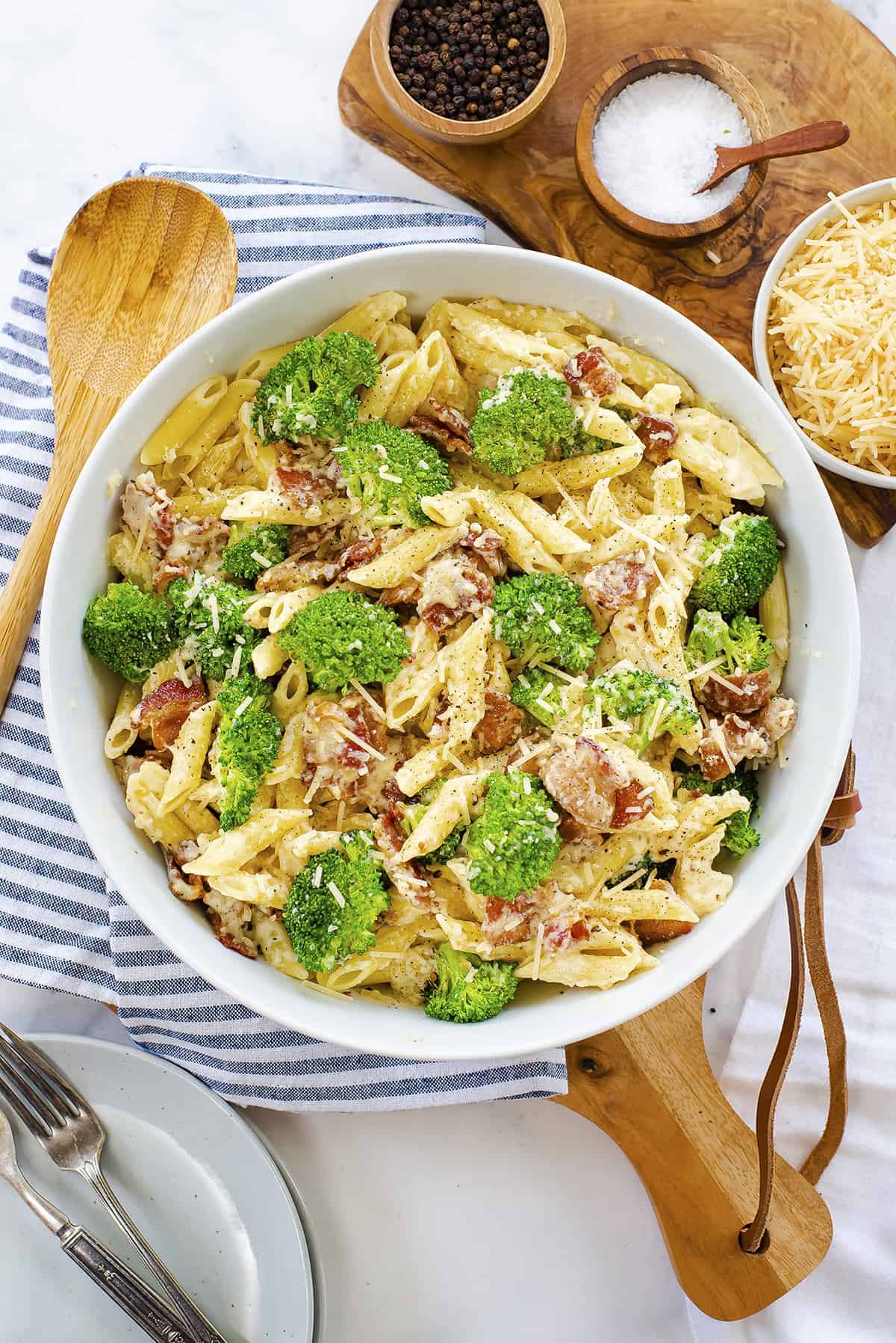 Overhead view of penne alfredo in white bowl.