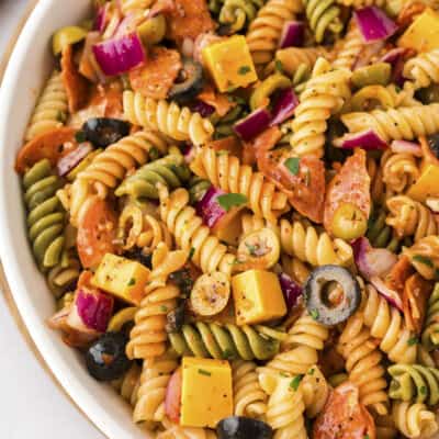 Pasta salad in white bowl.