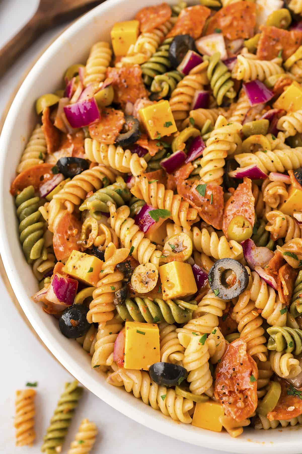 Pasta salad in white bowl.