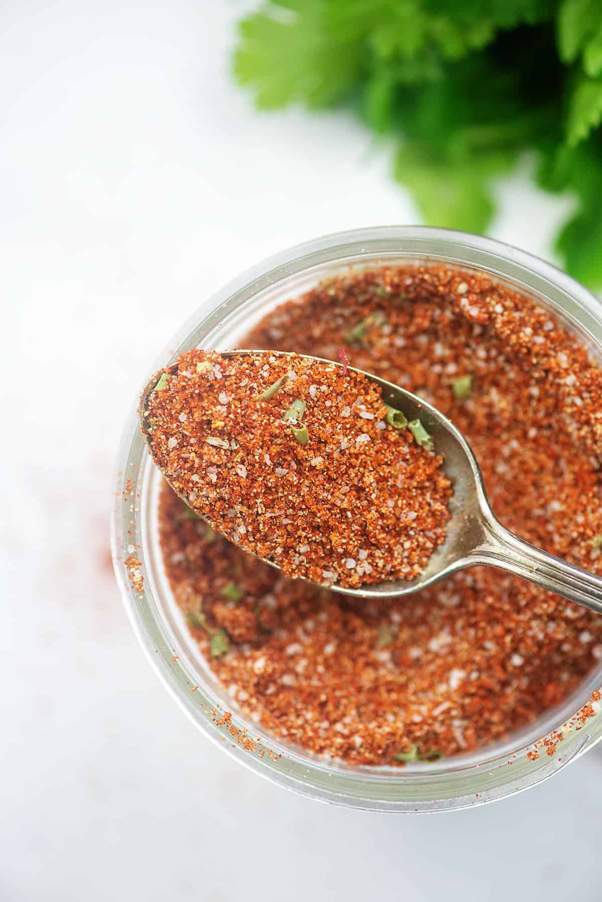 dry rub for chicken on spoon in mason jar