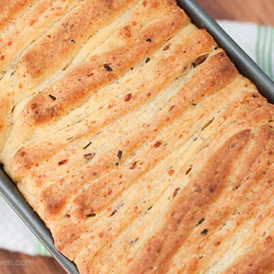 Overhead view of pull-apart bread in a bread pan.