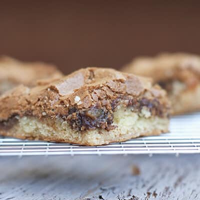 The closeup of a hot fudge peanut butter bar on a cooling rack