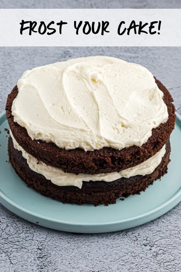 chocolate layer cake with frosting on top.