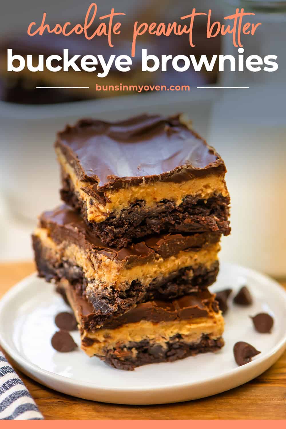 STack of buckeye brownies on white plate.