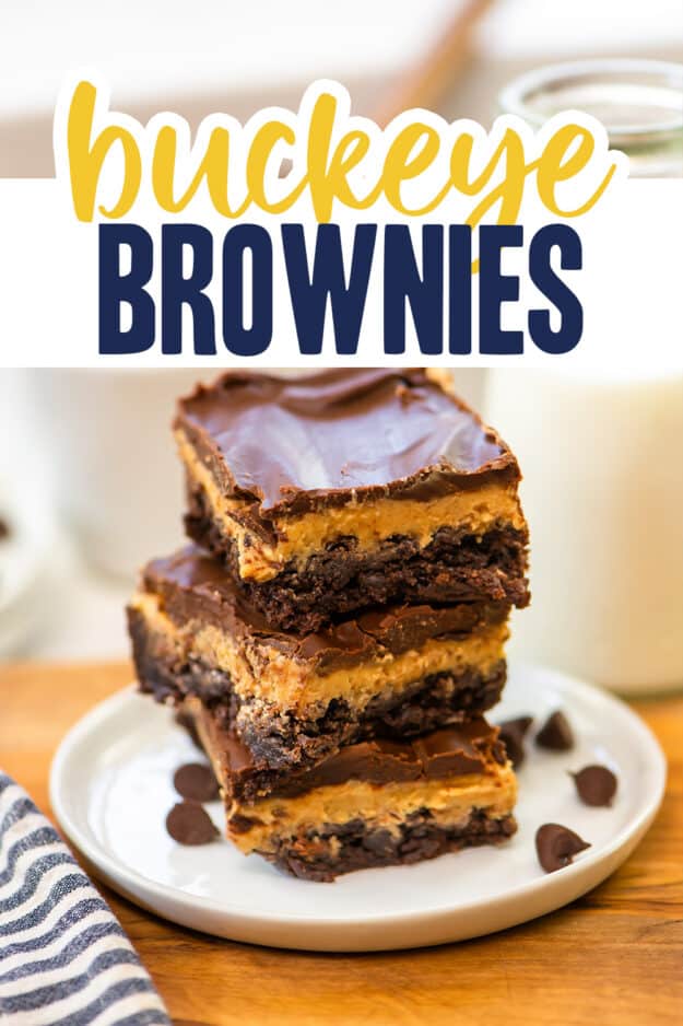 Brownies stacked on plate.