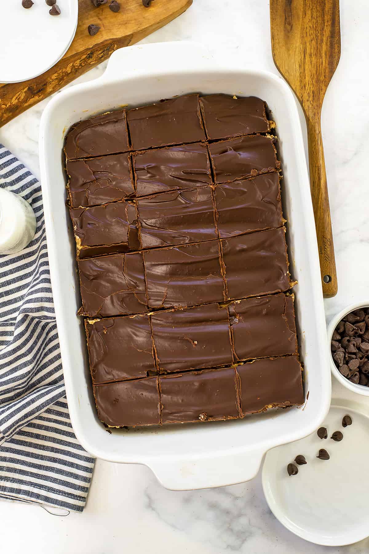 Overhead view of pan of brownies sliced into pieces.