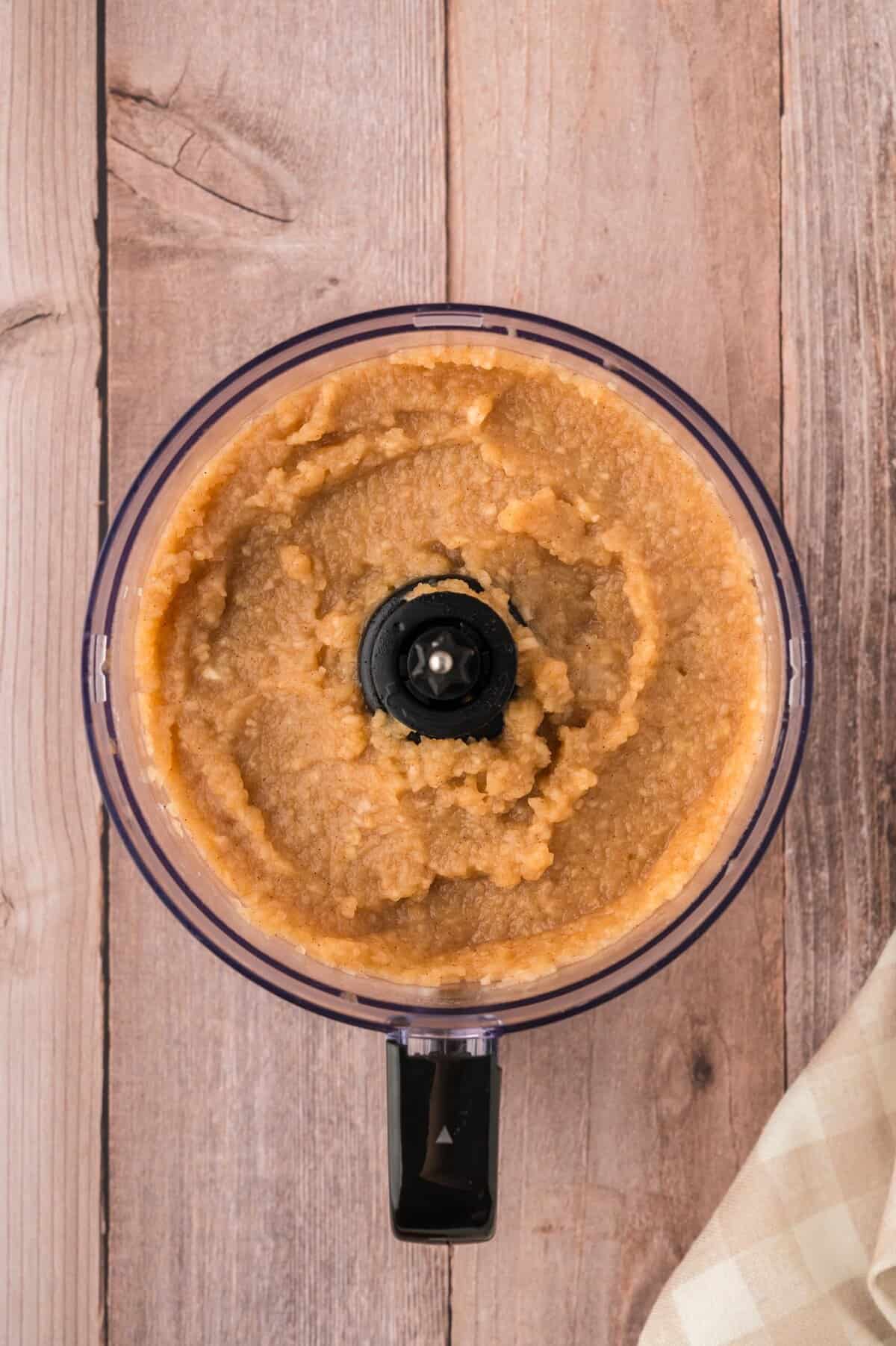 Pureed applesauce in food processor.