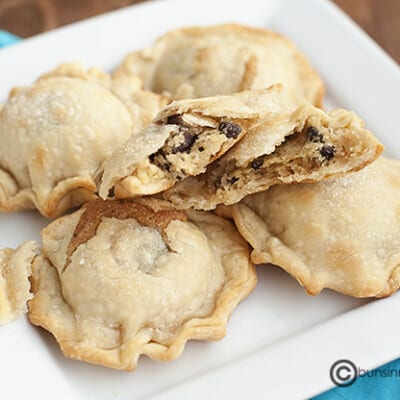 A plate of mini chocolate chip pies.