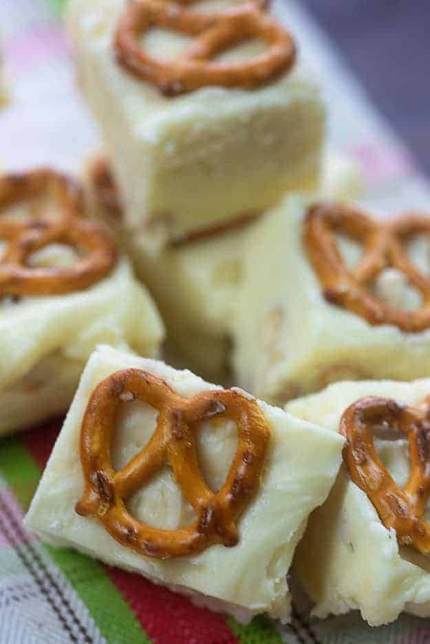 A stack of fudge with pretzels on top.