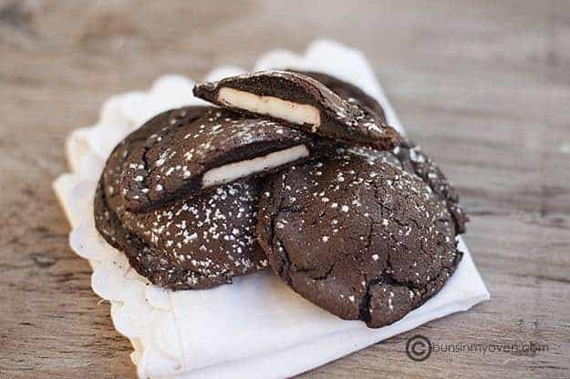 A close up of stacked chocolate peppermint cookies.