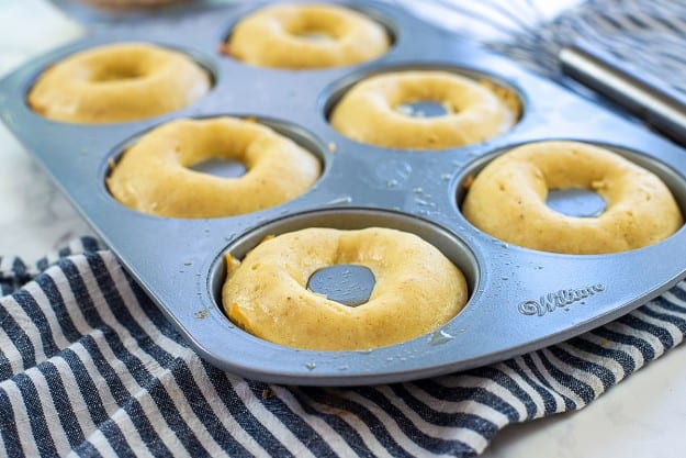 baked donuts in metal donut pan.