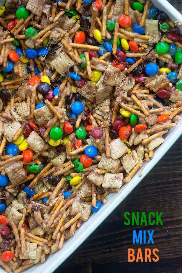 A close up of cereal bars in a white baking pan.