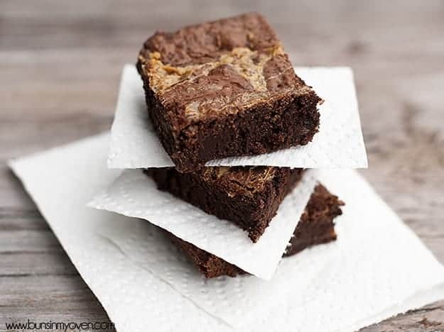 Three brownies on a white plate 