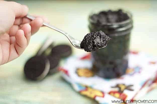 a spoonful of oreo cookie spread being held up to the camera