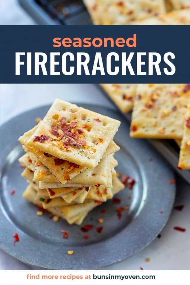 stack of seasoned crackers on metal plate.