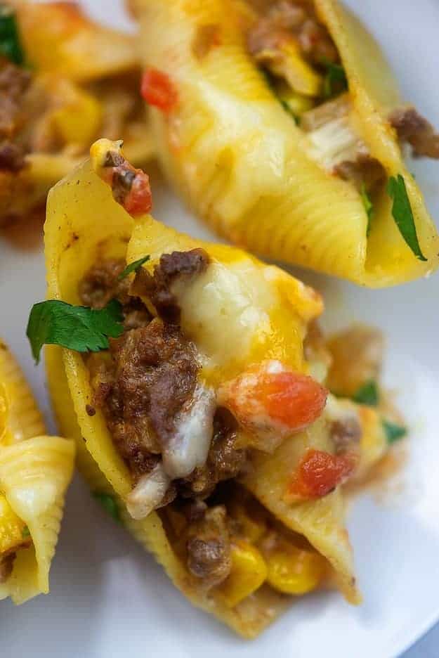 mexican stuffed shells on white plate