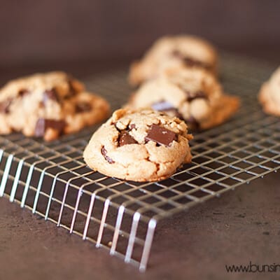 Peanut butter and chocolate chip cookies on a wire cooling rack