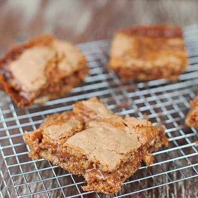 A few cinnamon caramel bars on a wire cooling rack
