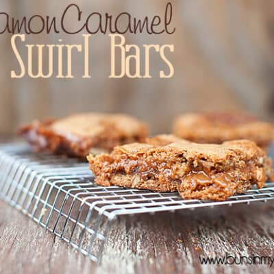 A close up of a few cinnamon caramel bars on a wire cooling rack
