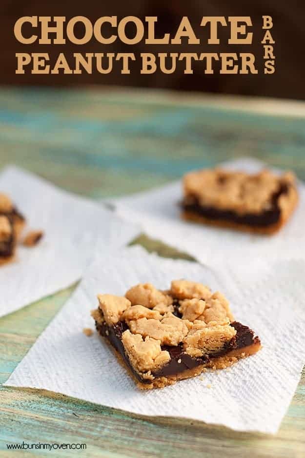 Three chocolate peanut butter bars on paper towels.