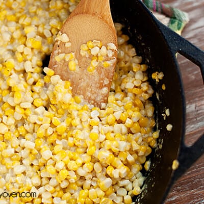 A close up of southern cream corn in a cast-iron skillet