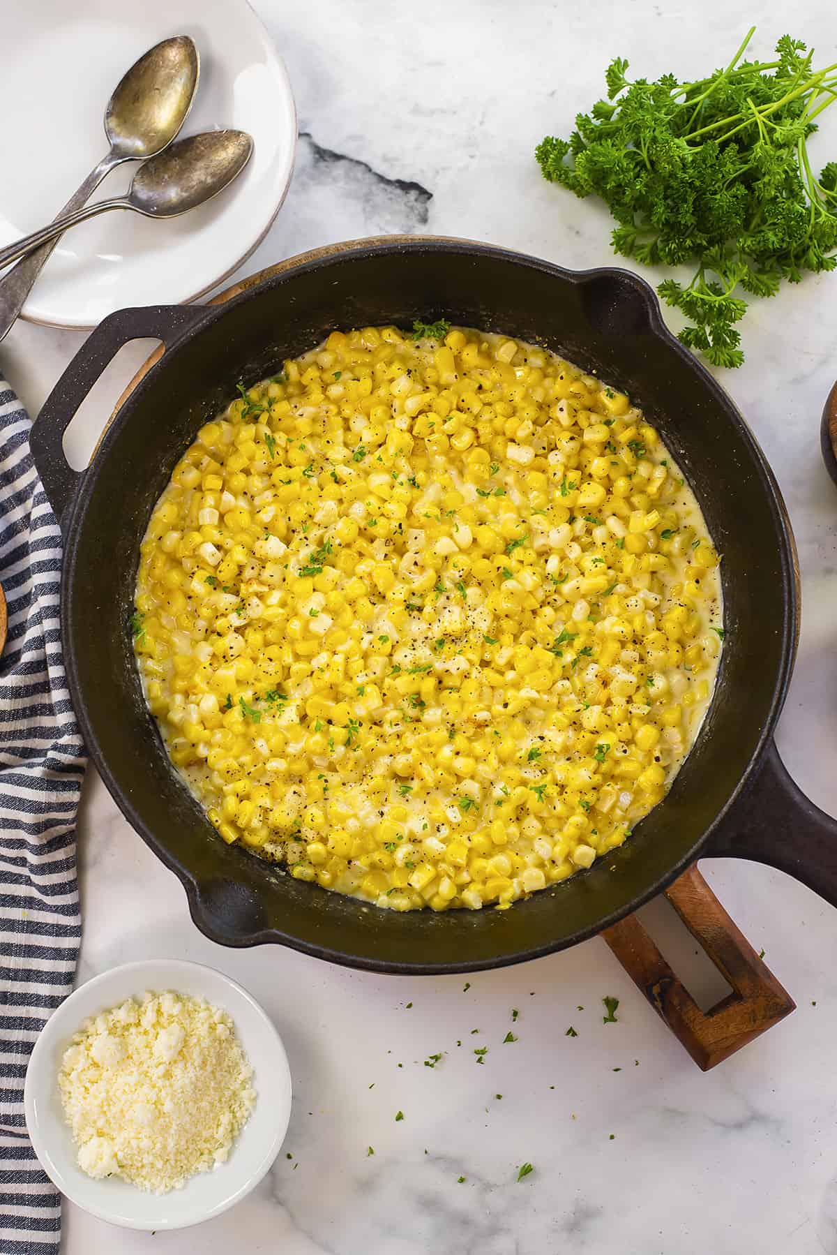 Skillet full of creamed corn.