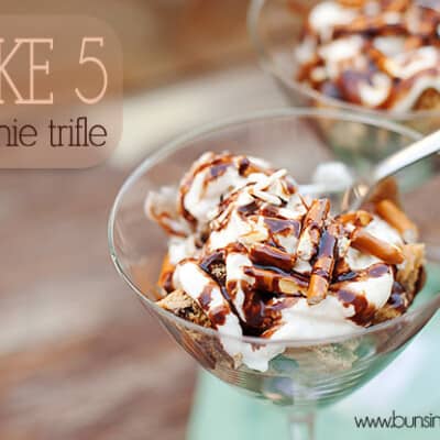 A close up of a pretzel brownie trifle in a martini glass.