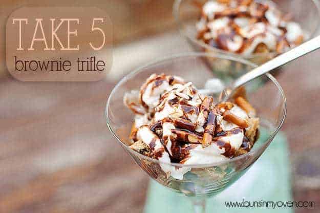 A close up of a pretzel brownie trifle in a martini glass.