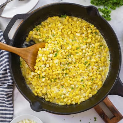 Creamed corn in cast iron skillet.