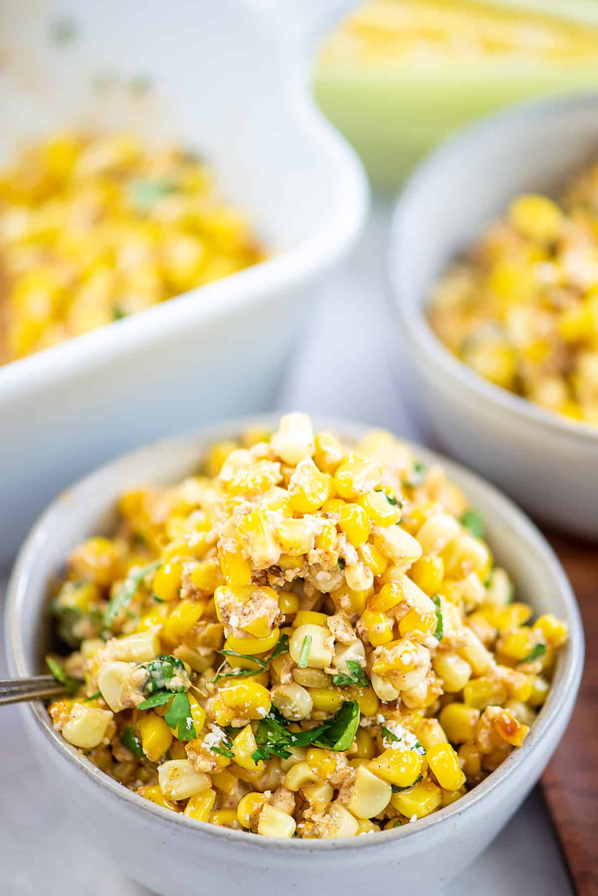 esquites in white bowl.