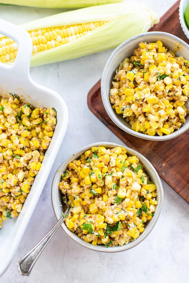 Mexican street corn in bowls.