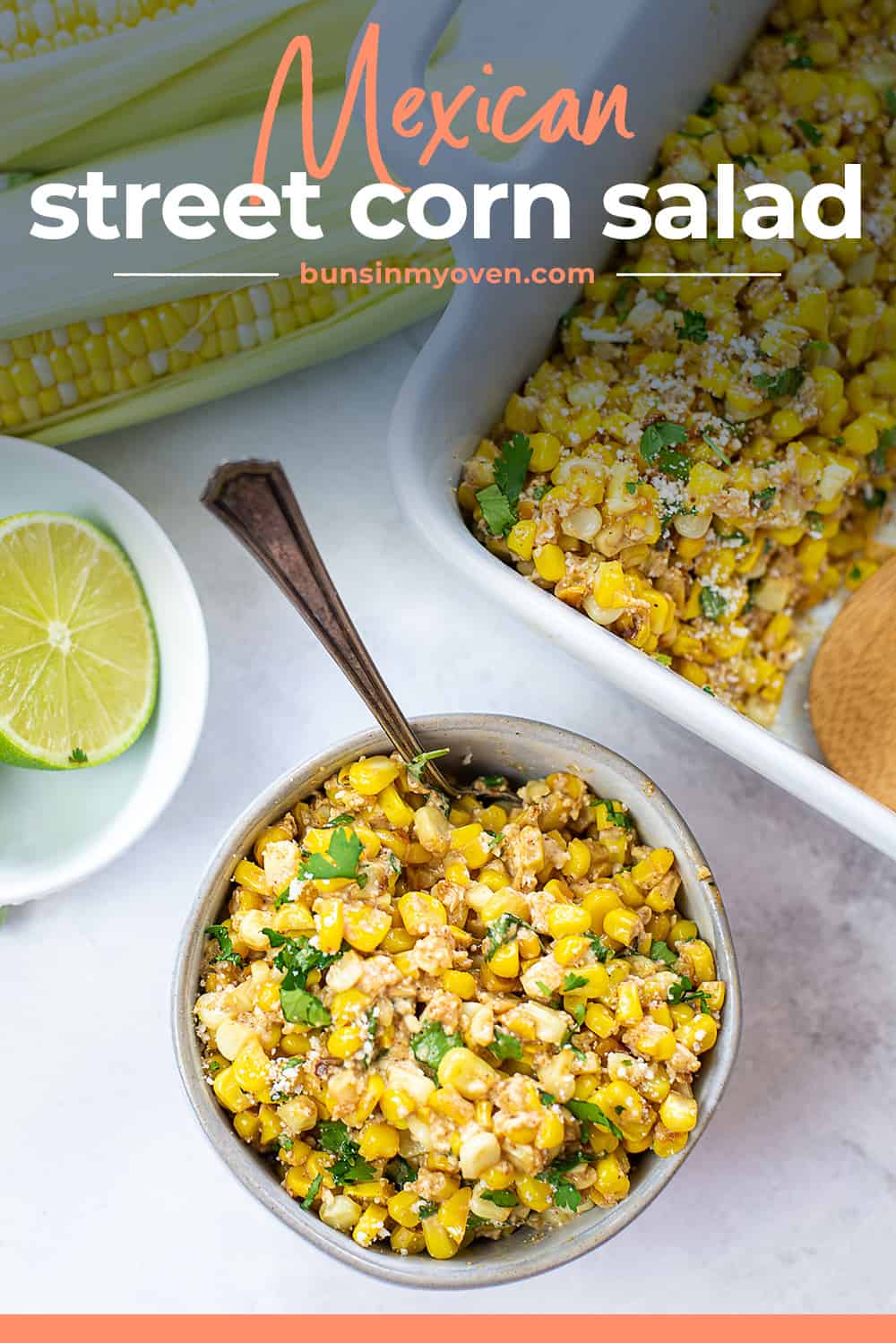 Mexican street corn salad in white bowl.