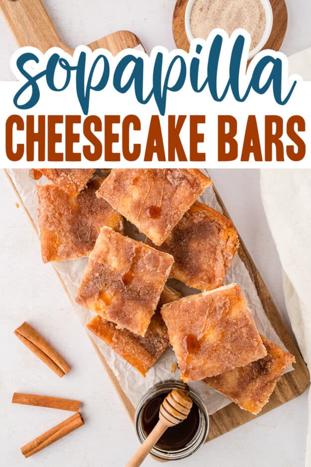 Cheesecake bars on wooden cutting board with text for Pinterest.