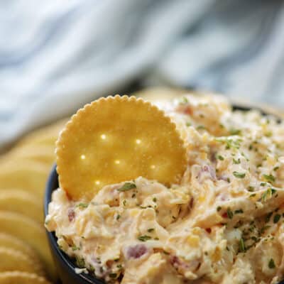 creamy pimento cheese recipe in a bowl with crackers.
