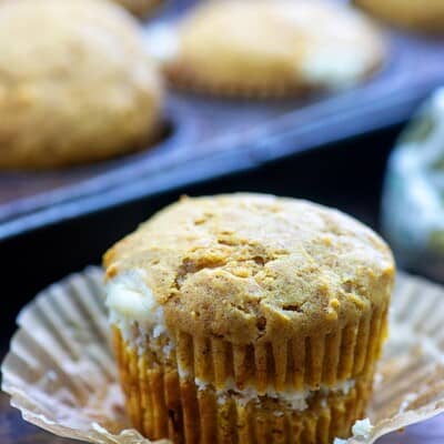 A close up of a cupcake sliced in the middle.