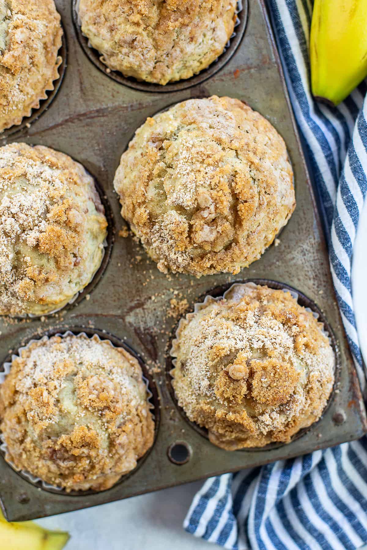 banana crumb muffins in muffin tin.