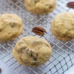 cookies and pecans on a cooling rack.