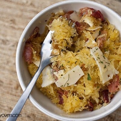 Overhead view  of spaghetti squash in a white bowl