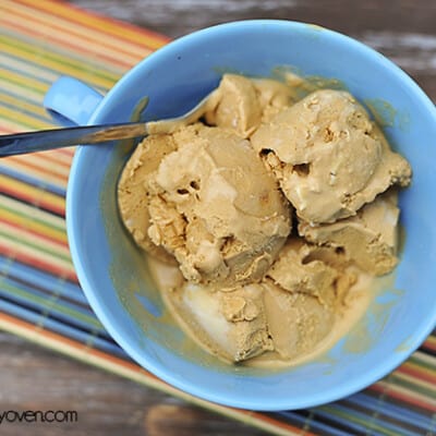 An overhead view of caramel ice cream in a bowl