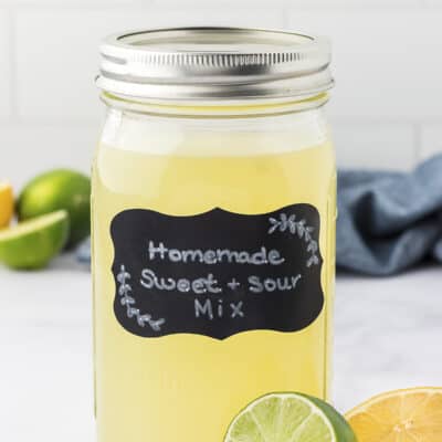 Homemade sour mix in mason jar with label.