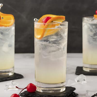 Three cocktail glasses full of vodka collins.