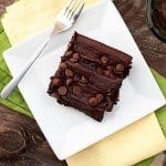 A piece of chocolate pudding dump cake on a white plate.