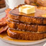 Stack of eggnog french toast on plate.