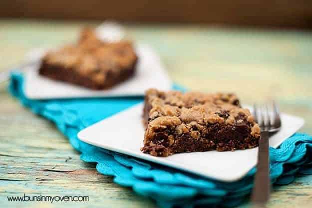 A chocolate chip cookie bar on a folded blue napkin.