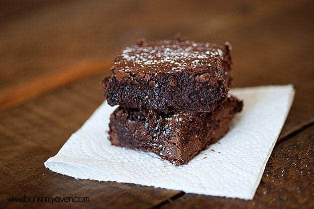 A paper towel with a couple of brownies on top.